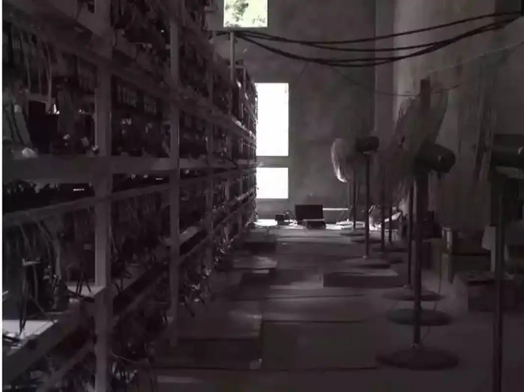 A single ASIC miner sits unused in a garage.