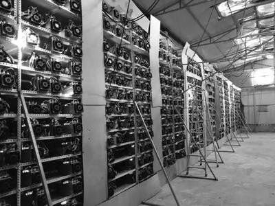 A photo of a mining farm showcasing rows of mining rigs and advanced cooling systems.