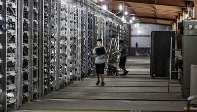 Inside a modern mining farm with racks of mining machines